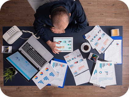 top-view-businessman-using-tablet-pc-analyzing-financial-charts-documents-sitting-desk-corporate-office 1 top-view-businessman-using-tablet-pc-analyzing-financial-charts-documents-sitting-desk-corporate-office 1